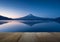 Wooden terrace and mountain fuji with reflection at lake kawaguchiko