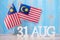 Wooden text of August 31 with Malaysia flags. Malaysia Independence day