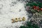 Wooden text numbers on the snow with a Christmas tree