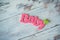 Wooden text pink baby on a wooden background.