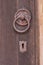 Wooden texture of old door with handle and keyhole, background