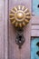 Wooden texture of old door with handle and keyhole, background