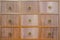 Wooden textured drawers wall background in chinese herbal medicine shop in chinese drug store