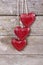 Wooden three red hearts