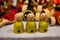 Wooden three yellow dressed bald doll with spectacles. Gandhi model