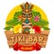 Wooden Tiki mask and signboard of bar