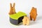 Wooden toy cat, bear and rabbit and black sponges for washing dishes and other domestic or household needs. Concept of