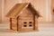 A wooden toy folding house shot large on a wooden background