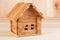 A wooden toy folding house shot large on a wooden background