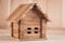 A wooden toy folding house shot large on a wooden background