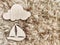 Wooden toy ship on a beige furry background. Concept of beautiful travel. Adventurous trip by boat or yacht. Sports