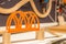 Wooden toy train, bridge. miniature railroad bridge. The black engine pulling colorful cars on the floor. Educational