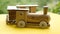 Wooden toy train on yellow table