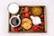 Wooden Tray with Breakfast Freshly Baked Buns with Raisins and Cinnamon Cup of Black Coffee Cream Ripe Strawberry and Orange Jam