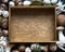 Wooden tray in the center and a frame of various mushrooms