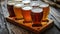 Wooden Tray With Multiple Glasses of Beer - Refreshing Beverages for a Social Gathering