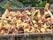 Wooden tray of onions drying outdoors