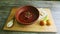 Wooden tray served with traditional ukrainian borscht and doughnuts