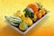 Wooden tray with variety of pumpkins.