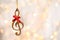 Wooden treble clef against blurred lights. Christmas music