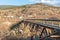 Wooden trestle bridge across a ravine on the Kettle Valley Rail Trail in the Okanagan Valley