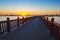 The wooden trestle on the lake sunset