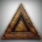 wooden triangle on a gray background