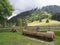 Wooden trough with spring water wide angel view