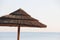 Wooden umbrella on the beach