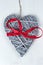 Wooden Valentines Day heart with red ribbon bow