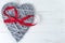 Wooden Valentines Day heart with red ribbon bow