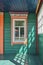 Wooden veranda with windows. Buddhist temple in Ivolginsky Datsan, Buryatia, Russia