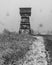 Wooden view tower on Kozia Gora hill above Prudnik town in Poland during heavy snowffaling