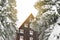 wooden village rural house,mansion,hotel covered in snow,icicles in winter forest mountains