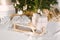 Wooden vintage sleigh with a blanket and gifts under the Christmas tree. Christmas decor in the interior of the house