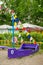 Wooden violet boat with coloful flags on sandy playground