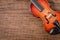 Wooden violin stringed instrument on old wooden.