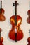 Wooden violins hanging on the wall