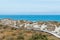 Wooden walking path over sand beach and ocean skyline