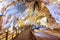 Wooden walkway through amazing natural corridor, Paradise Cave