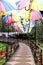 Wooden walkway with colorful umbrellas