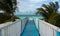 Wooden walkway on the empty beach of the island Cayo Guillermo.