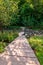 A wooden walkway leading to Nine Mile Run in Frick Park in Pittsburgh, Pennsylvania, USA