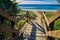 Wooden walkway leading to sandy beach, Queensland Sunshine Coast Australia