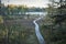 Wooden walkway leading to small trout lake in northern Minnesota