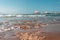 Wooden walkway leads across the blue sea in fine weather