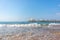 Wooden walkway leads across the blue sea in fine weather