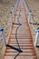 Wooden walkway over the sand dunes to the beach. Beach pathway in Lido di Ostia Lido di Roma, private beach Salvataggio, Italy.