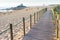 Wooden walkway, people, beach, church