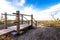 Wooden walkway on sand dune to beach.